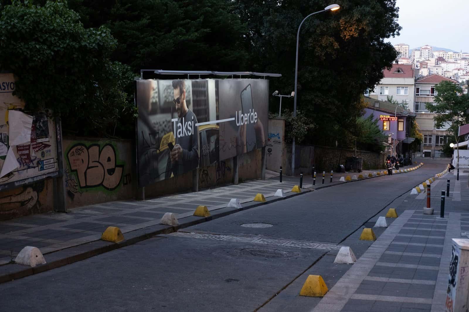 A city street with graffiti on the side of it